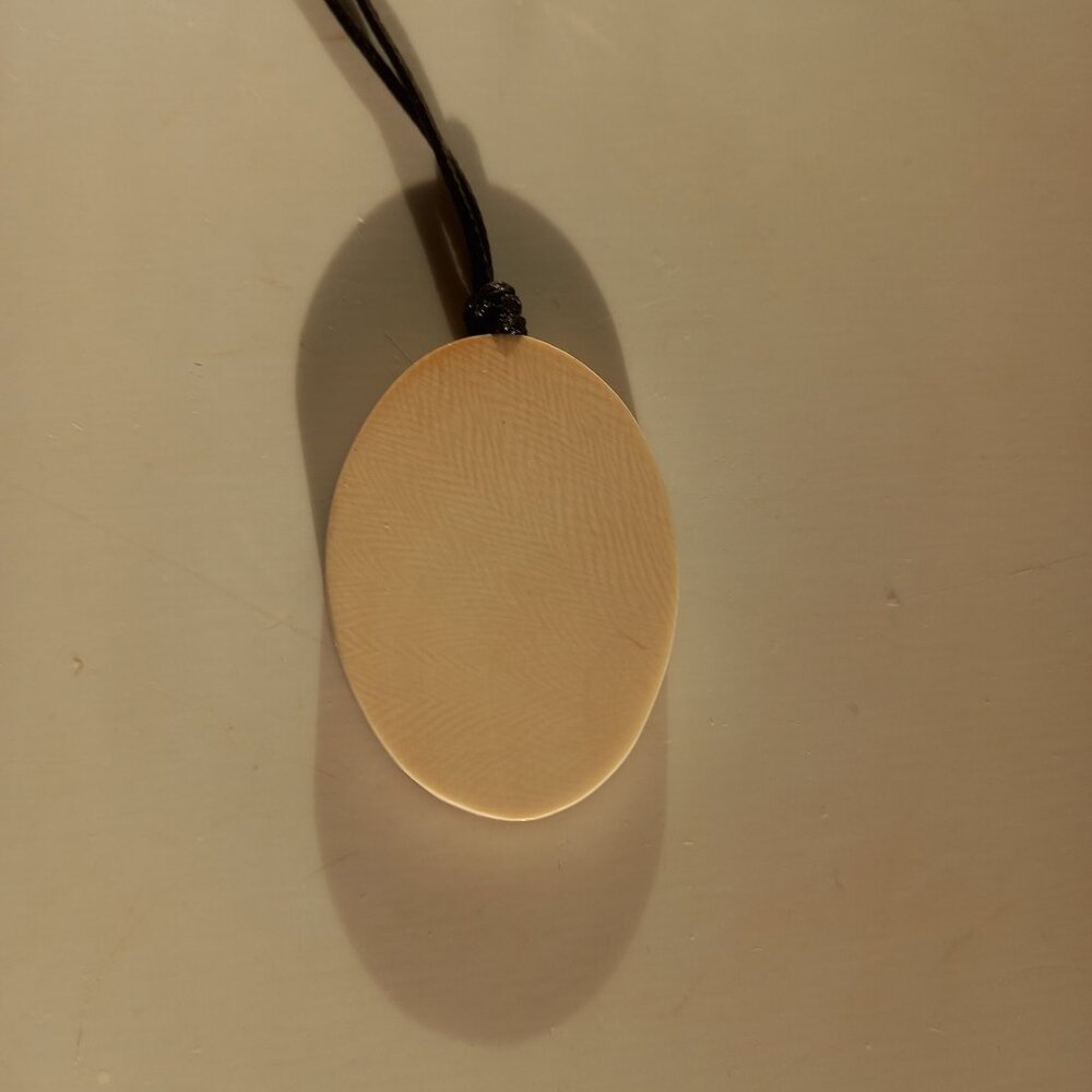 Mammoth tusk pendant in a hornbeam wood frame